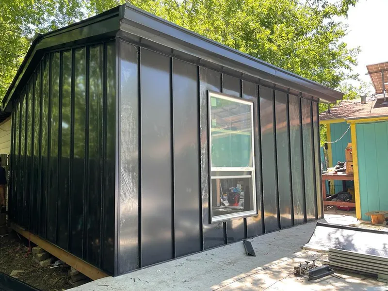 Black standing seam metal wall panels for Roof Inspection in Burnet