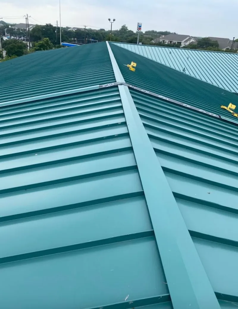 Green commercial metal roof ridge and valley for Metal Roof Repair in Burnet