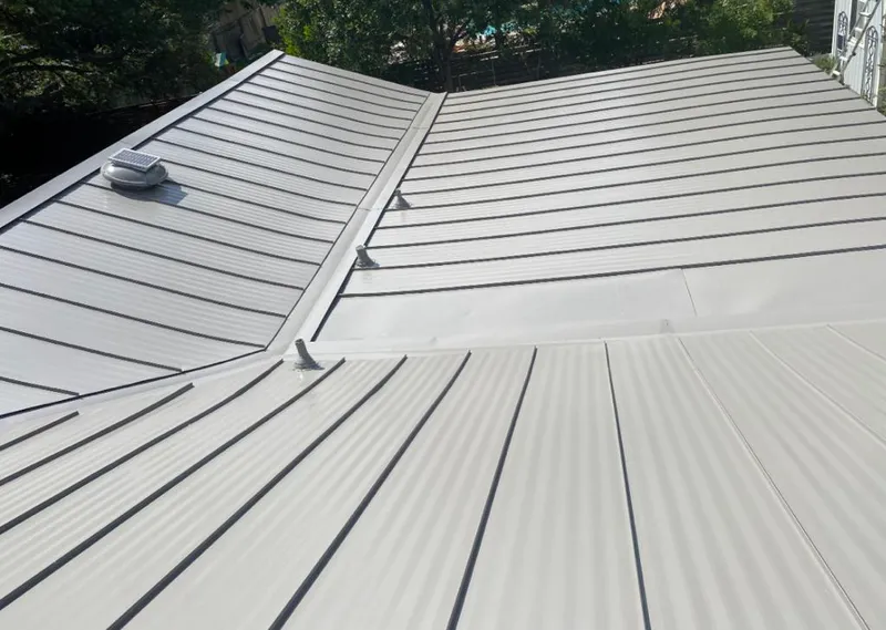 Solar attic fan installed on a metal roof for Roof Ventilation in Burnet